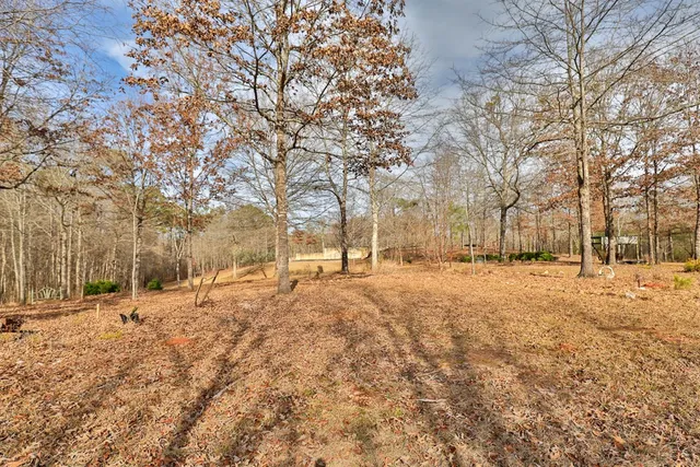 a coffee table sitting next to a shower curtain
