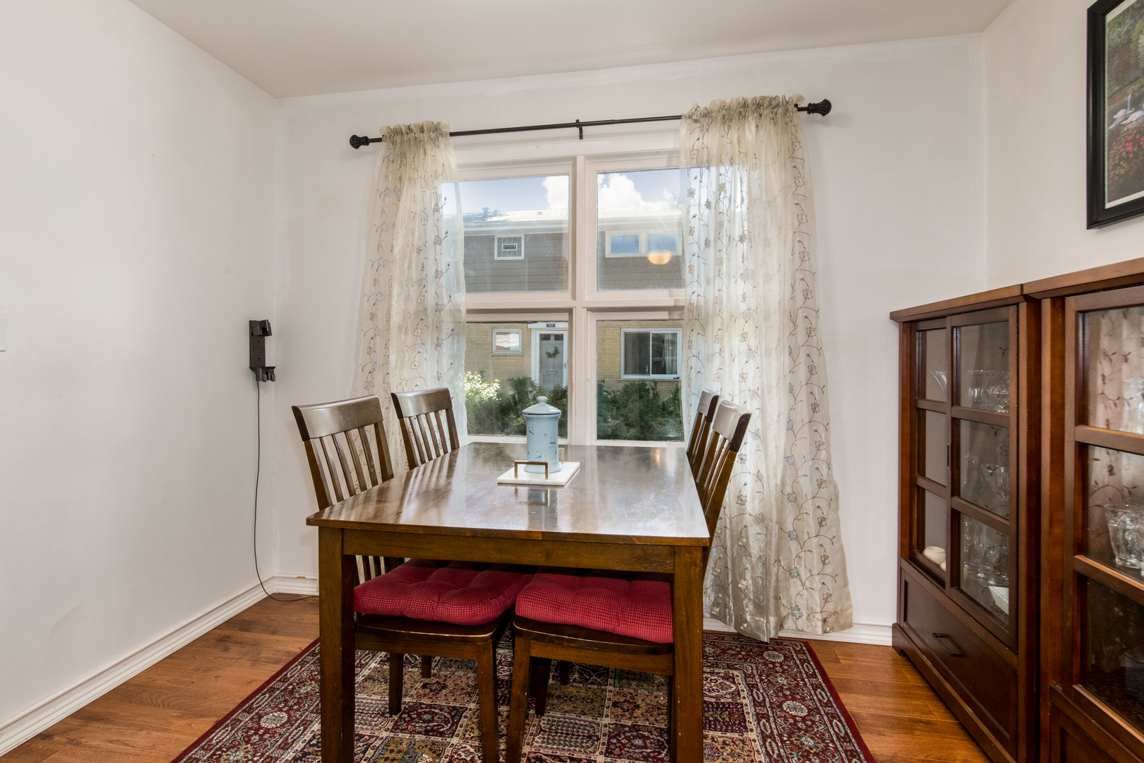 817 Hibbard Road, Unit D Wilmette, IL 60091 - Photo 12 of 26 a dining room with furniture window and wooden floor