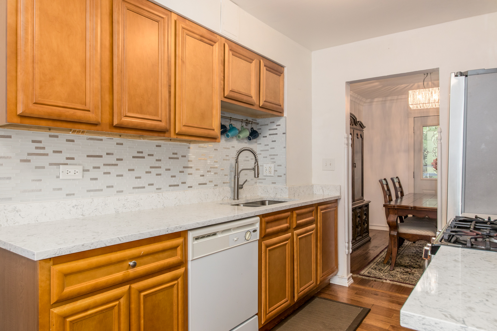 817 Hibbard Road, Unit D Wilmette, IL 60091 - Photo 14 of 26 a kitchen with stainless steel appliances granite countertop a sink stove and cabinets