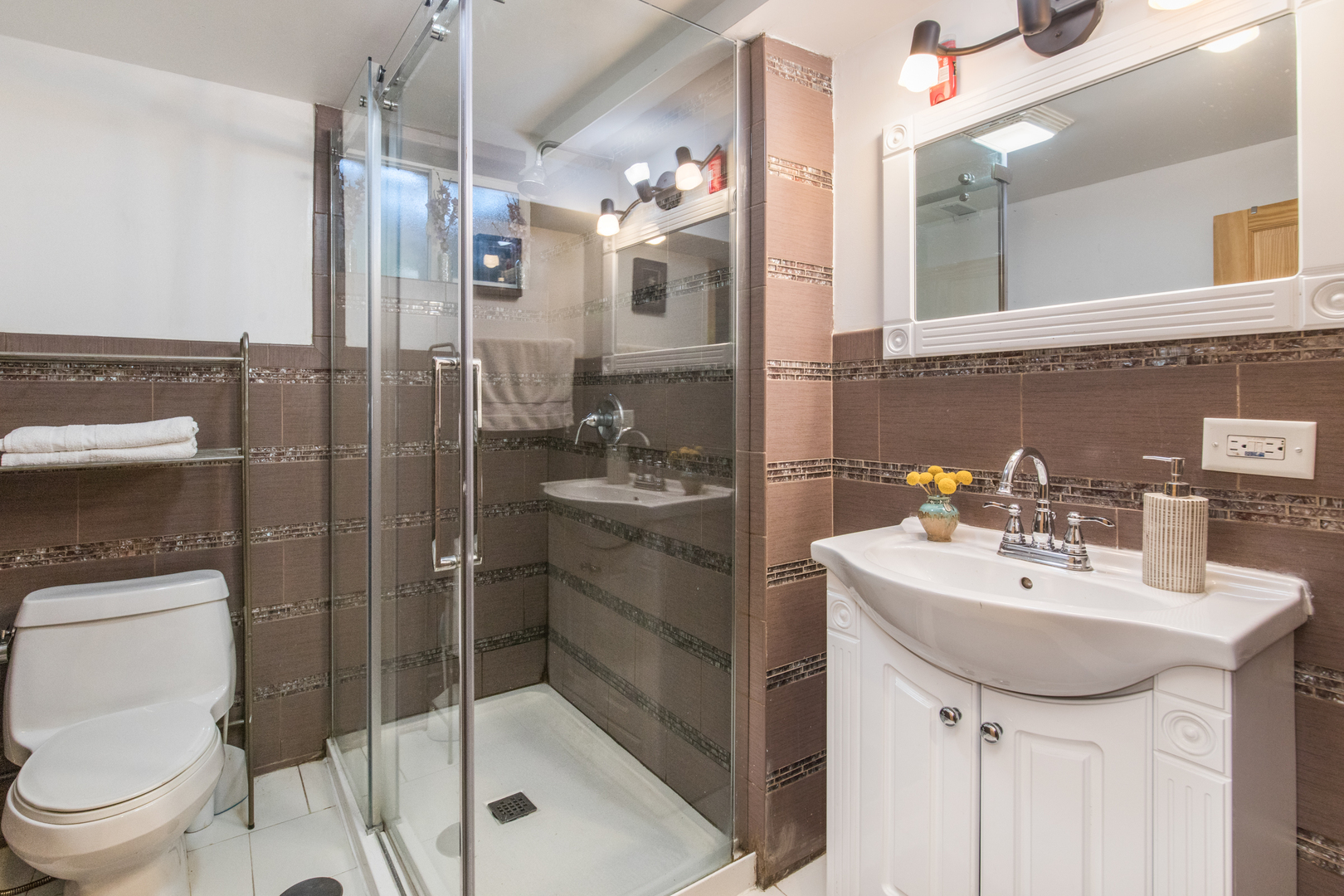 817 Hibbard Road, Unit D Wilmette, IL 60091 - Photo 18 of 26 a bathroom with a sink a toilet and shower