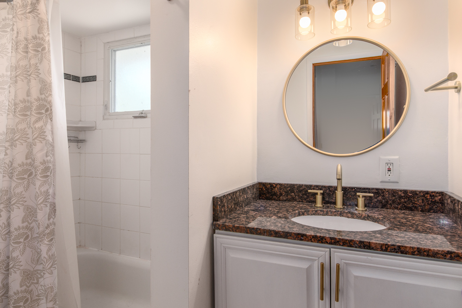 817 Hibbard Road, Unit D Wilmette, IL 60091 - Photo 20 of 26 a bathroom with a granite countertop sink and a mirror