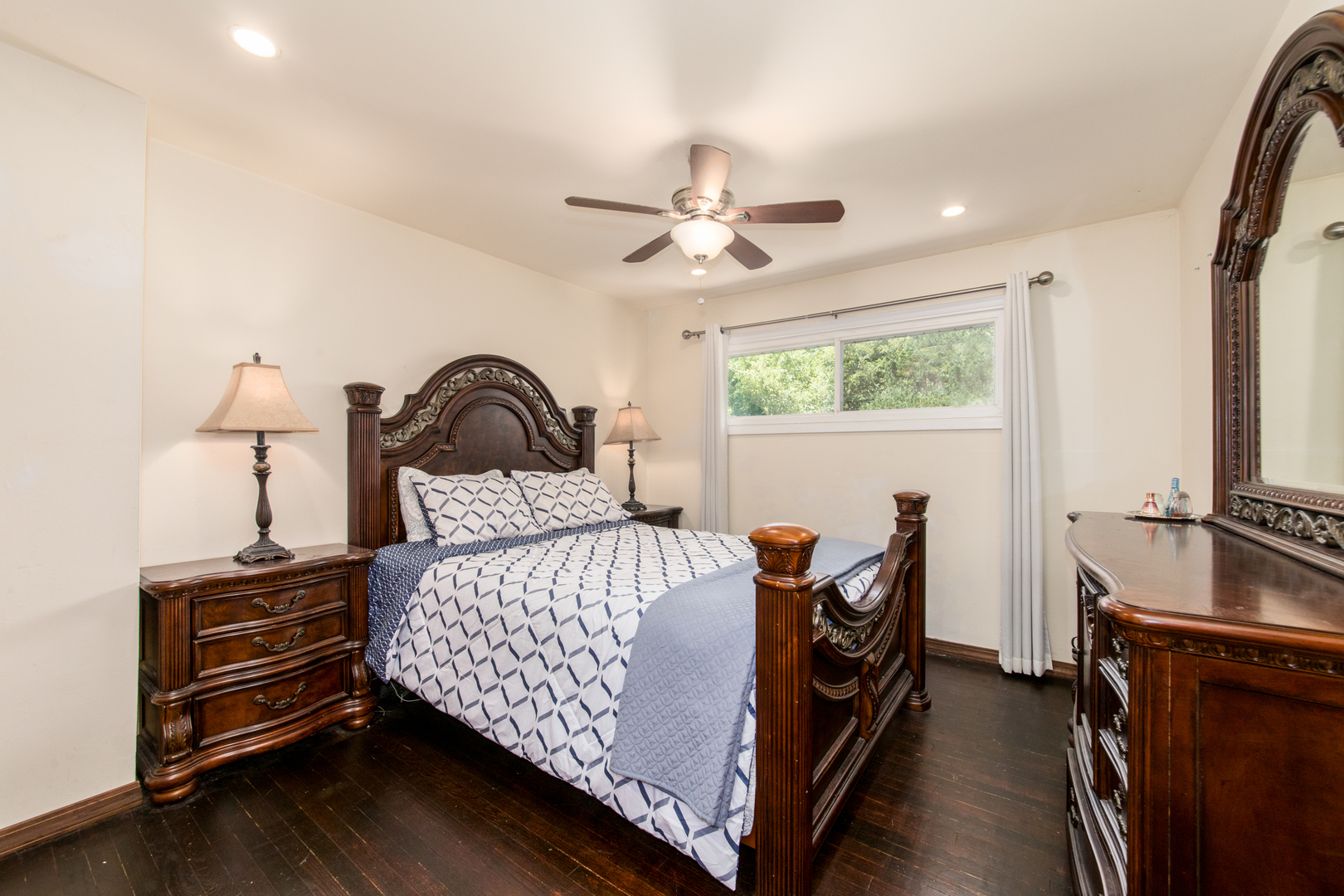 817 Hibbard Road, Unit D Wilmette, IL 60091 - Photo 22 of 26 a bedroom with a bed and a chandelier