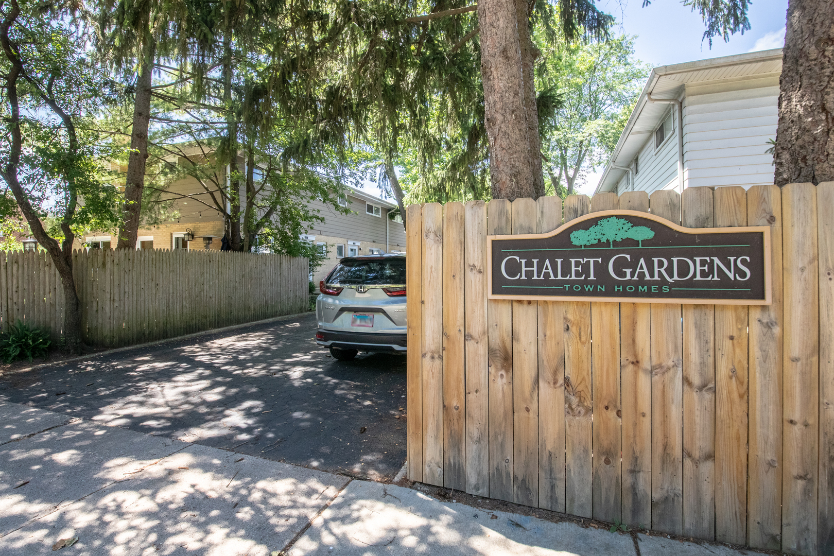817 Hibbard Road, Unit D Wilmette, IL 60091 - Photo 4 of 26 a view of outdoor space with signage and flags