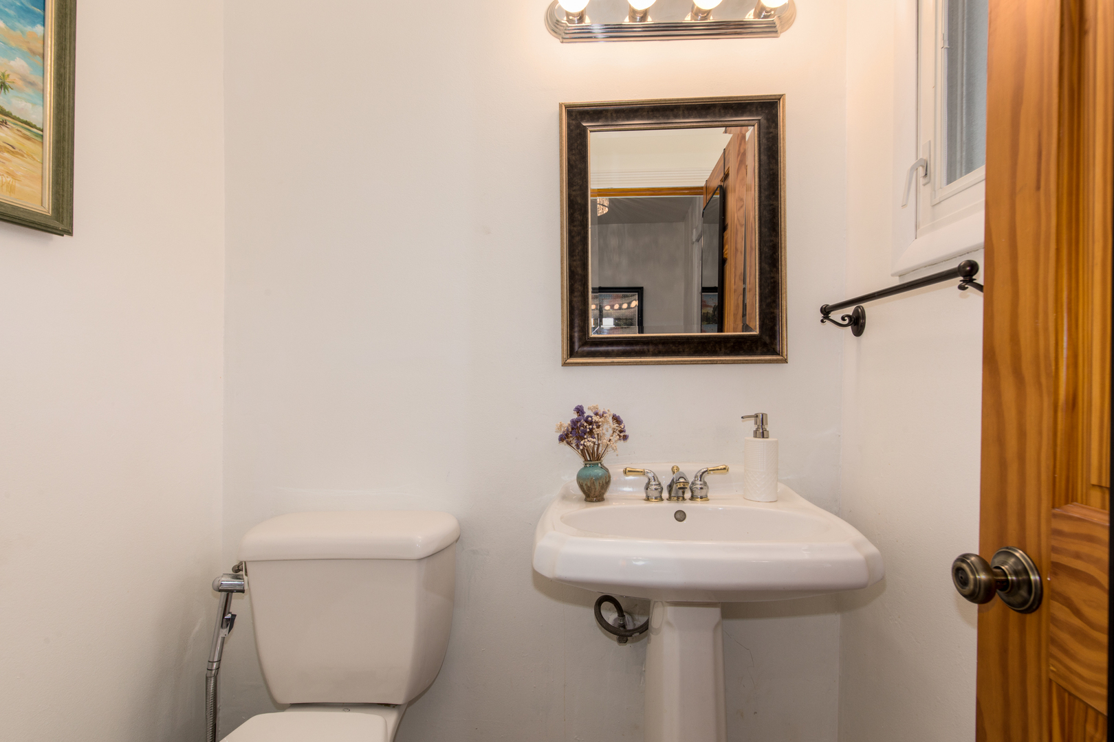 817 Hibbard Road, Unit D Wilmette, IL 60091 - Photo 10 of 26 a bathroom with a toilet sink and mirror