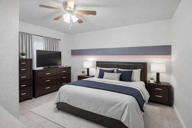 a bathroom with a granite countertop sink toilet and mirror