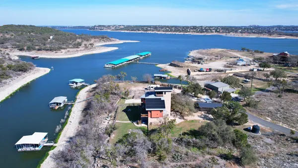a aerial view of a house with a lake view