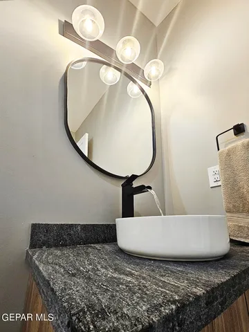 a bathroom with a tub and a sink