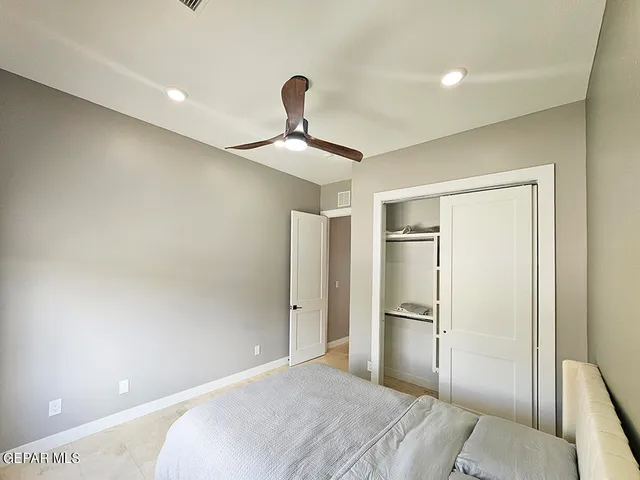 a bedroom with a bed and window