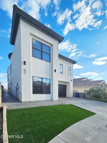 a front view of house with yard and entertaining space