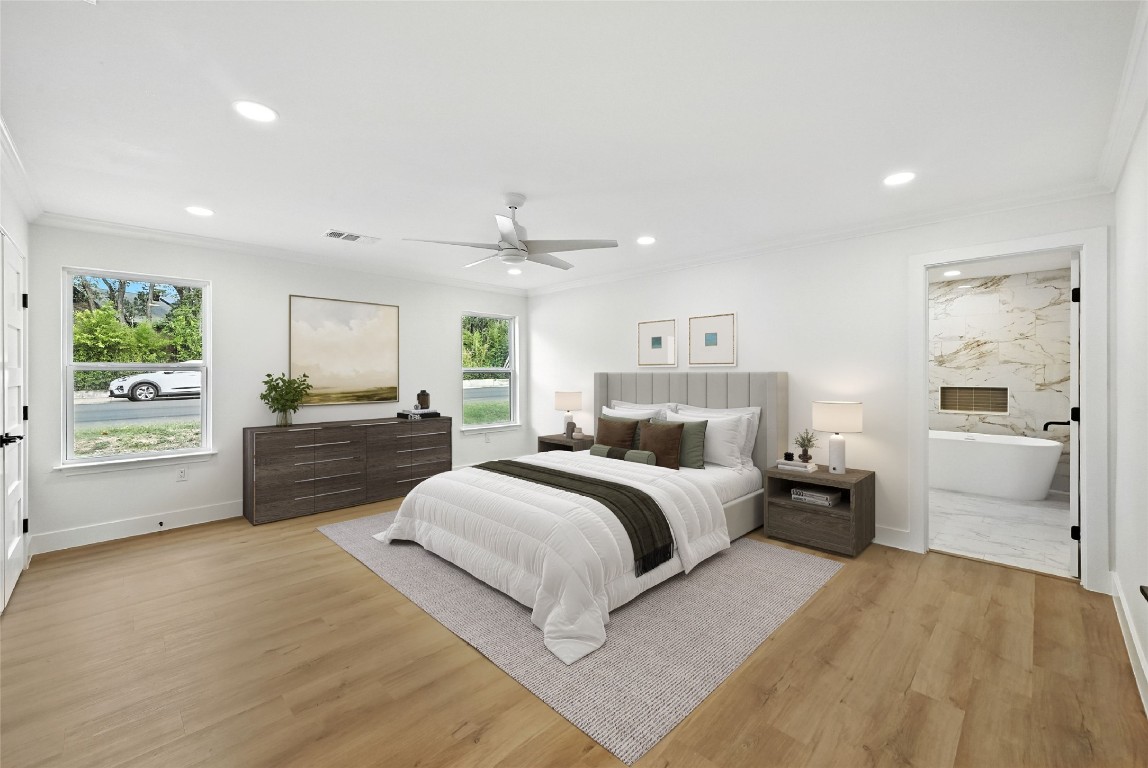 815 Buckingham Place Austin, TX 78745 - Photo 14 of 33 a large bedroom with a bed and a large window