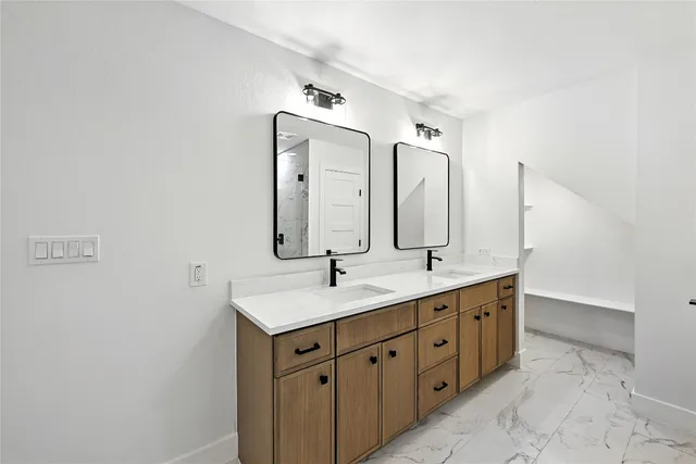a bathroom with 2 sink tub and a mirror