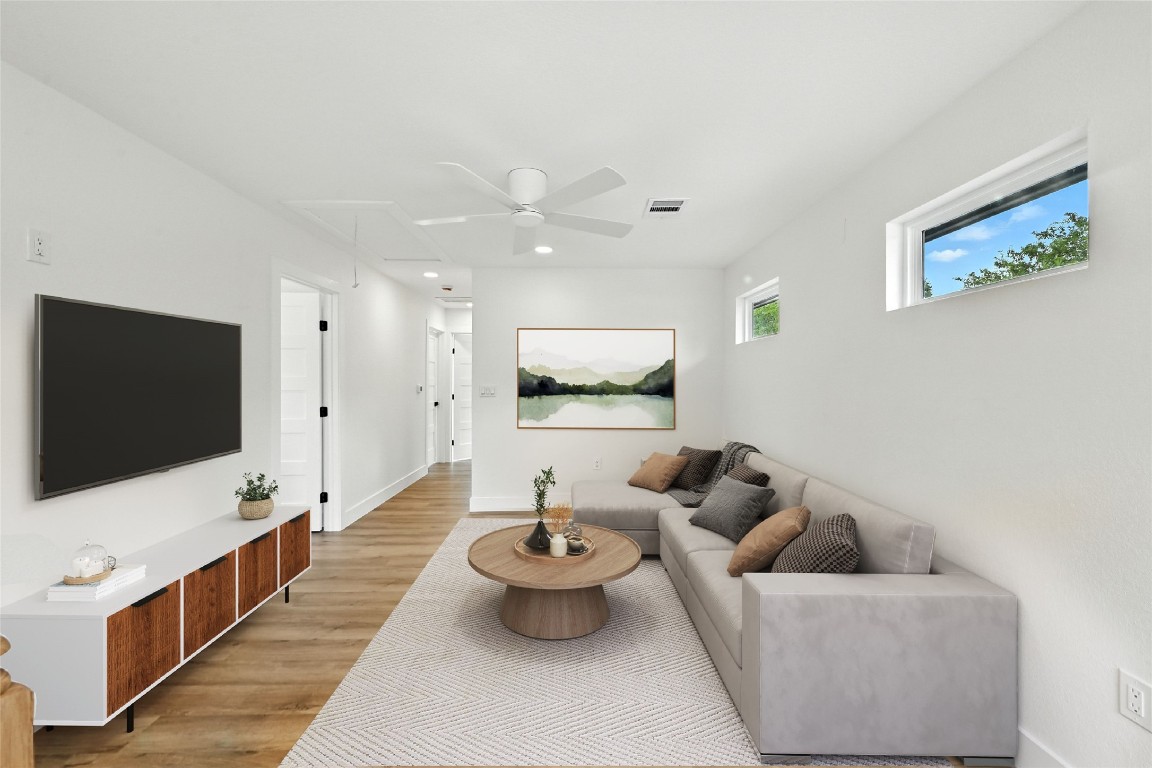 815 Buckingham Place Austin, TX 78745 - Photo 21 of 33 a living room with furniture and a flat screen tv
