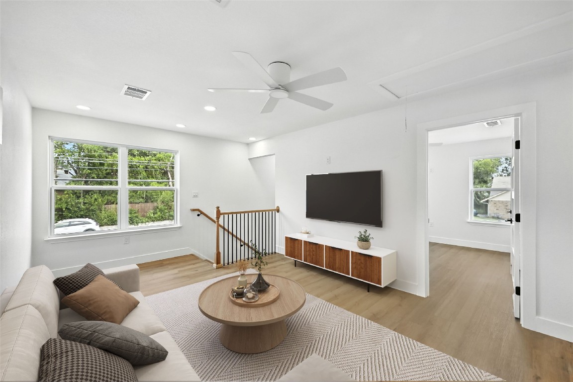 815 Buckingham Place Austin, TX 78745 - Photo 22 of 33 a living room with furniture and a flat screen tv
