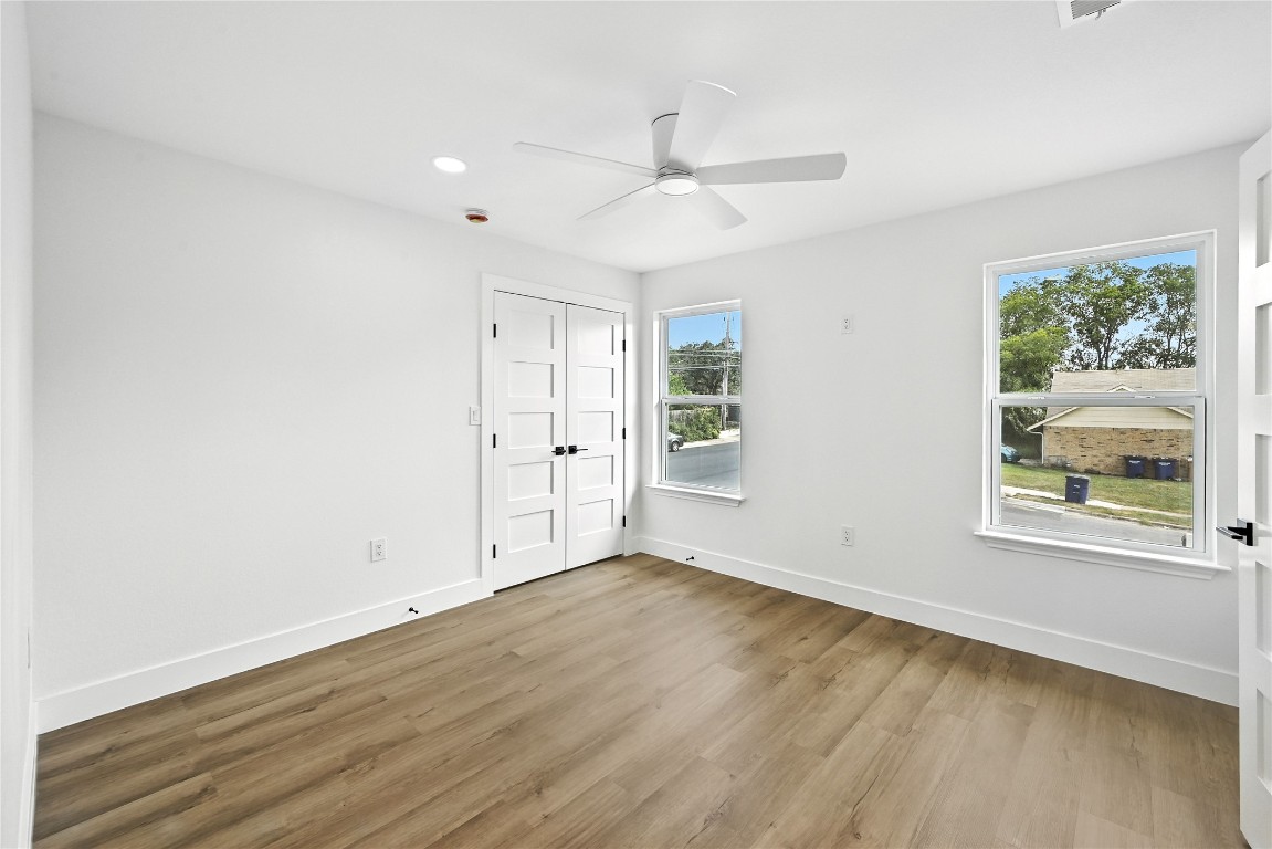 815 Buckingham Place Austin, TX 78745 - Photo 23 of 33 wooden floor in an empty room with a window