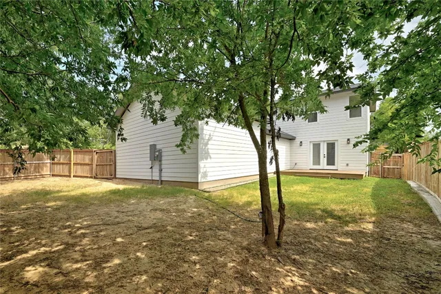 a view of backyard space and trees