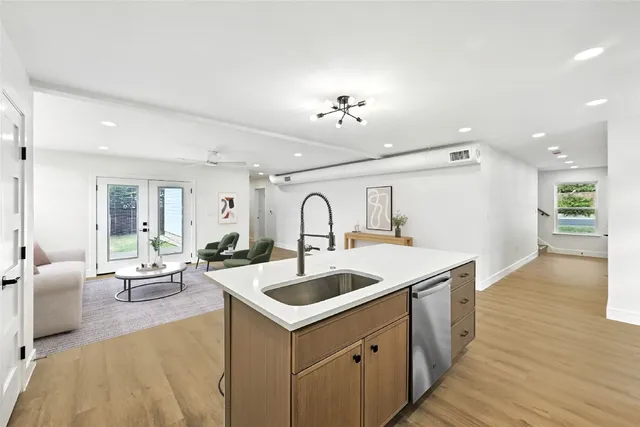 a view of living room kitchen with a sink and couch