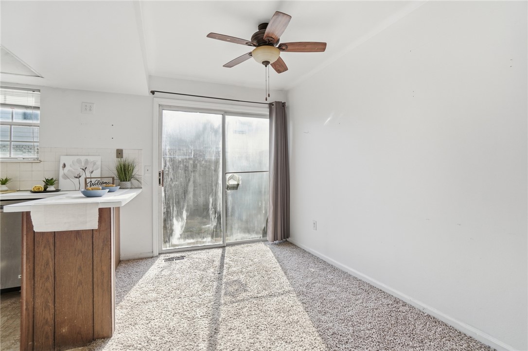 5414 Lamme Road Dayton, OH 45439 - Photo 11 of 32 Bright, inviting space featuring a sliding glass door and kitchen pass-through.