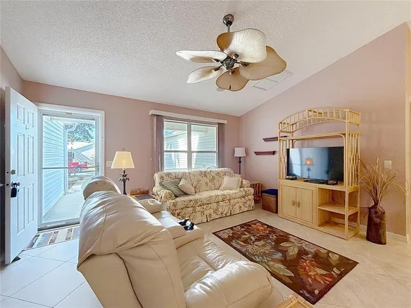 a large kitchen with a table and chairs