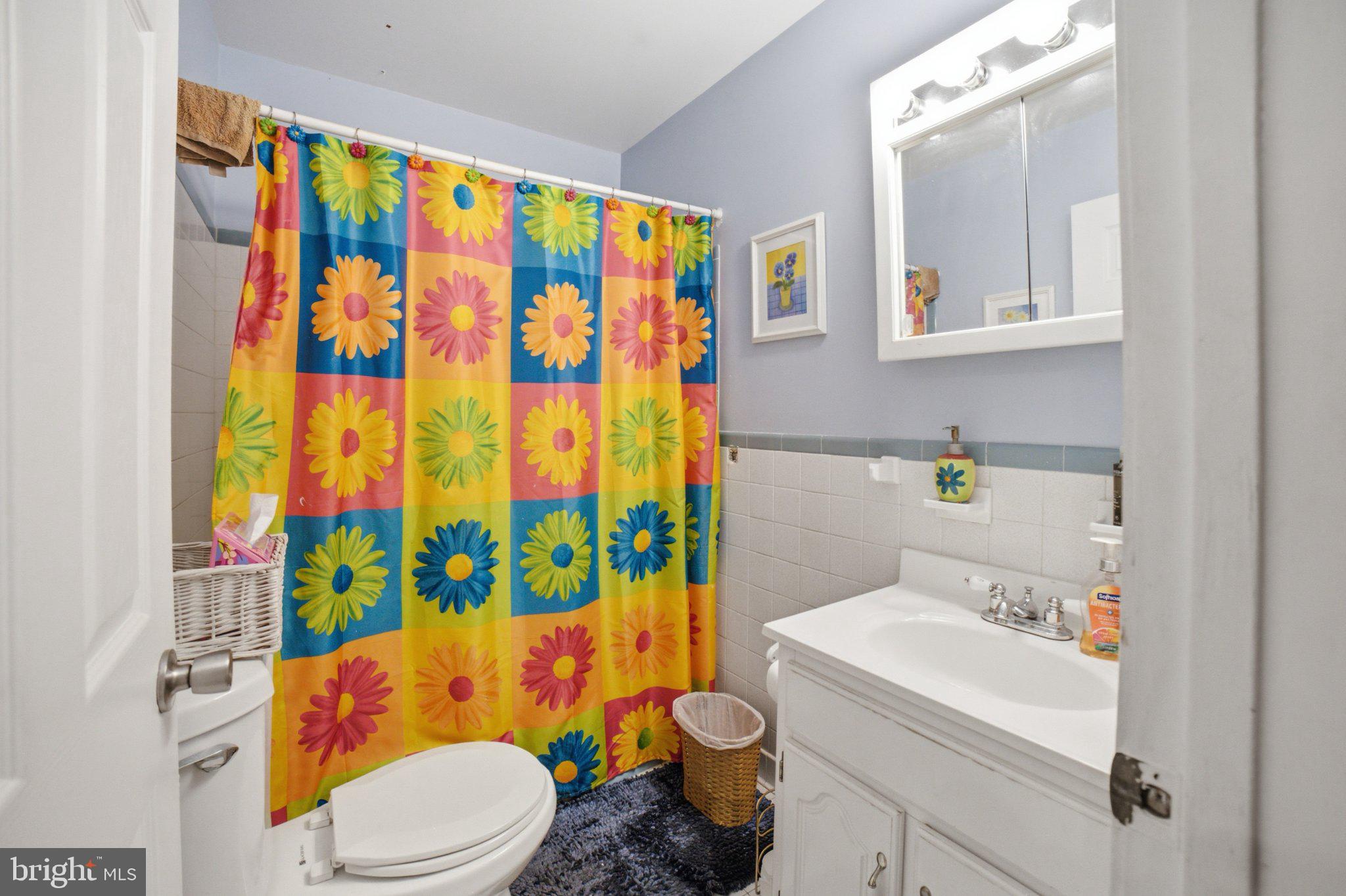 907 Logwood Road Capitol Heights, MD 20743 - Photo 7 of 16 Vibrant floral bathroom retreat.
