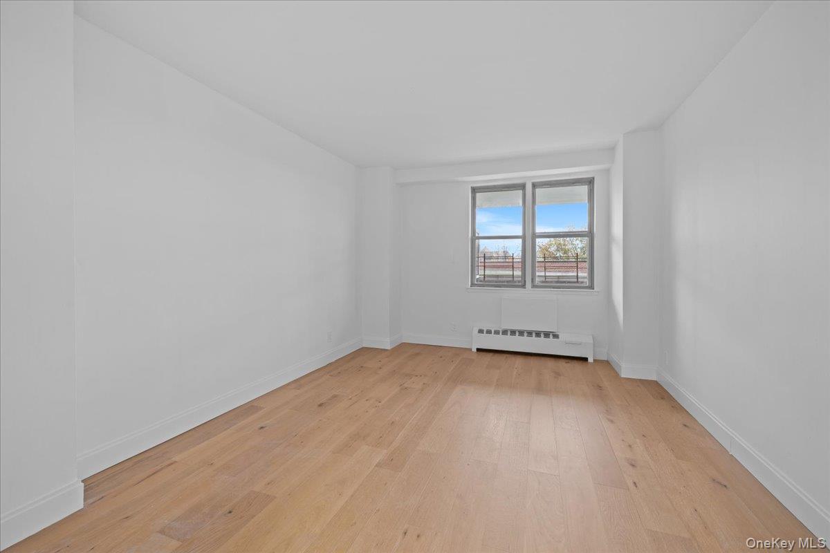 5700 Arlington Avenue, Unit 1C Bronx, NY 10471 - Photo 14 of 18 an empty room with a window
