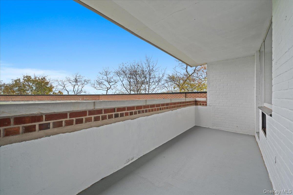 5700 Arlington Avenue, Unit 1C Bronx, NY 10471 - Photo 15 of 18 a view of a big room with wooden floor and windows