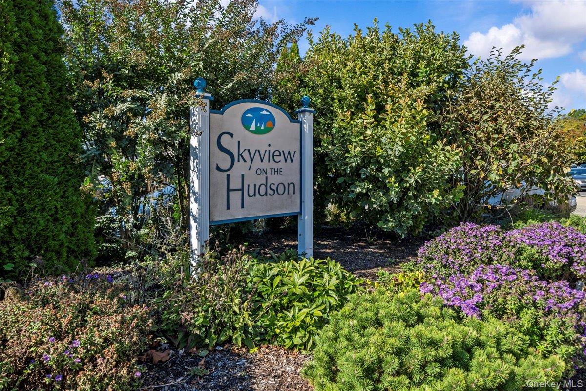 5700 Arlington Avenue, Unit 1C Bronx, NY 10471 - Photo 2 of 18 a sign that is sitting in front of flowers