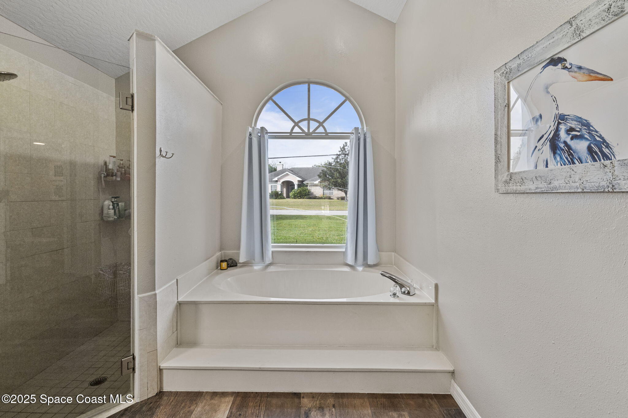 4089 Mallard Drive Melbourne, FL 32934 - Photo 16 of 53 a bathroom with a tub and window