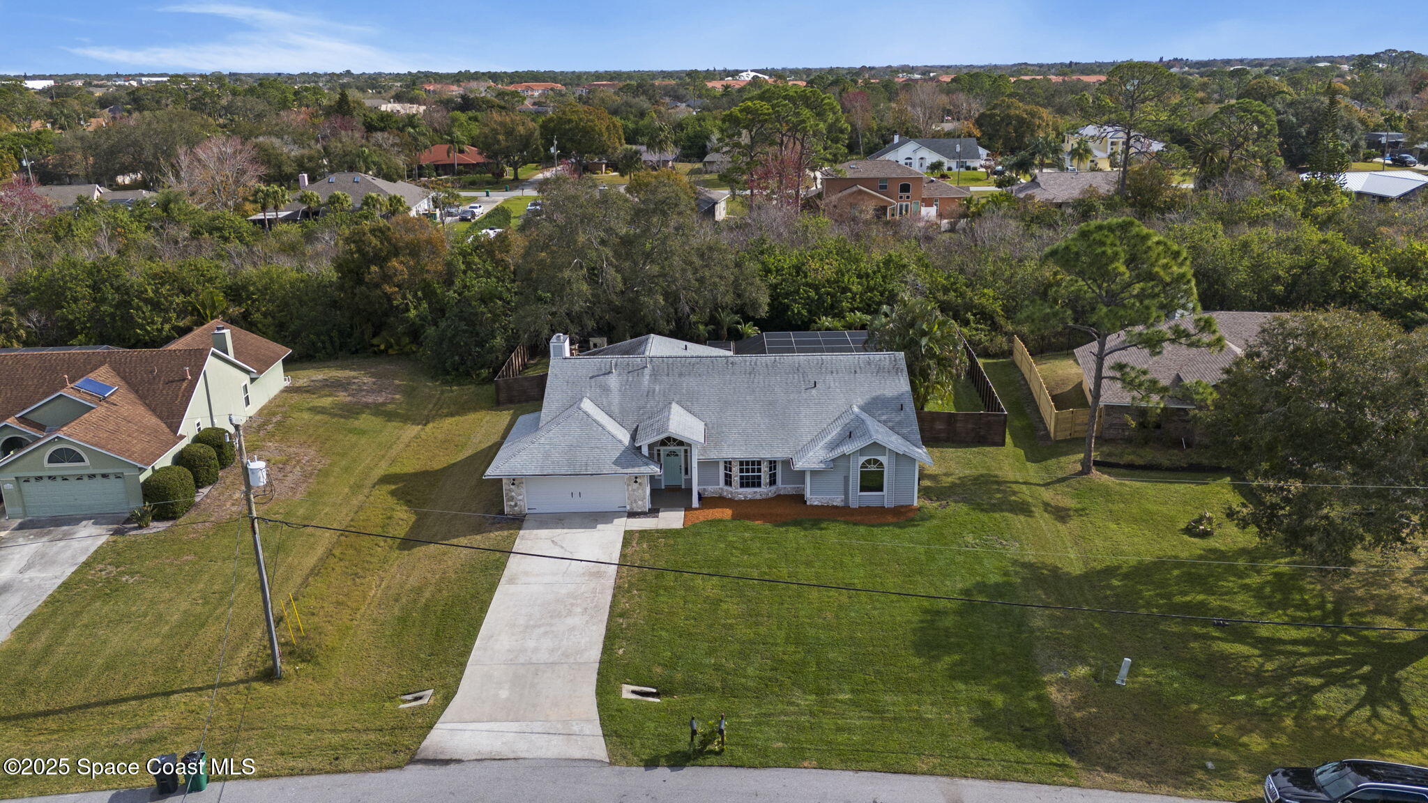 4089 Mallard Drive Melbourne, FL 32934 - Photo 2 of 53 an aerial view of residential houses with outdoor space and trees