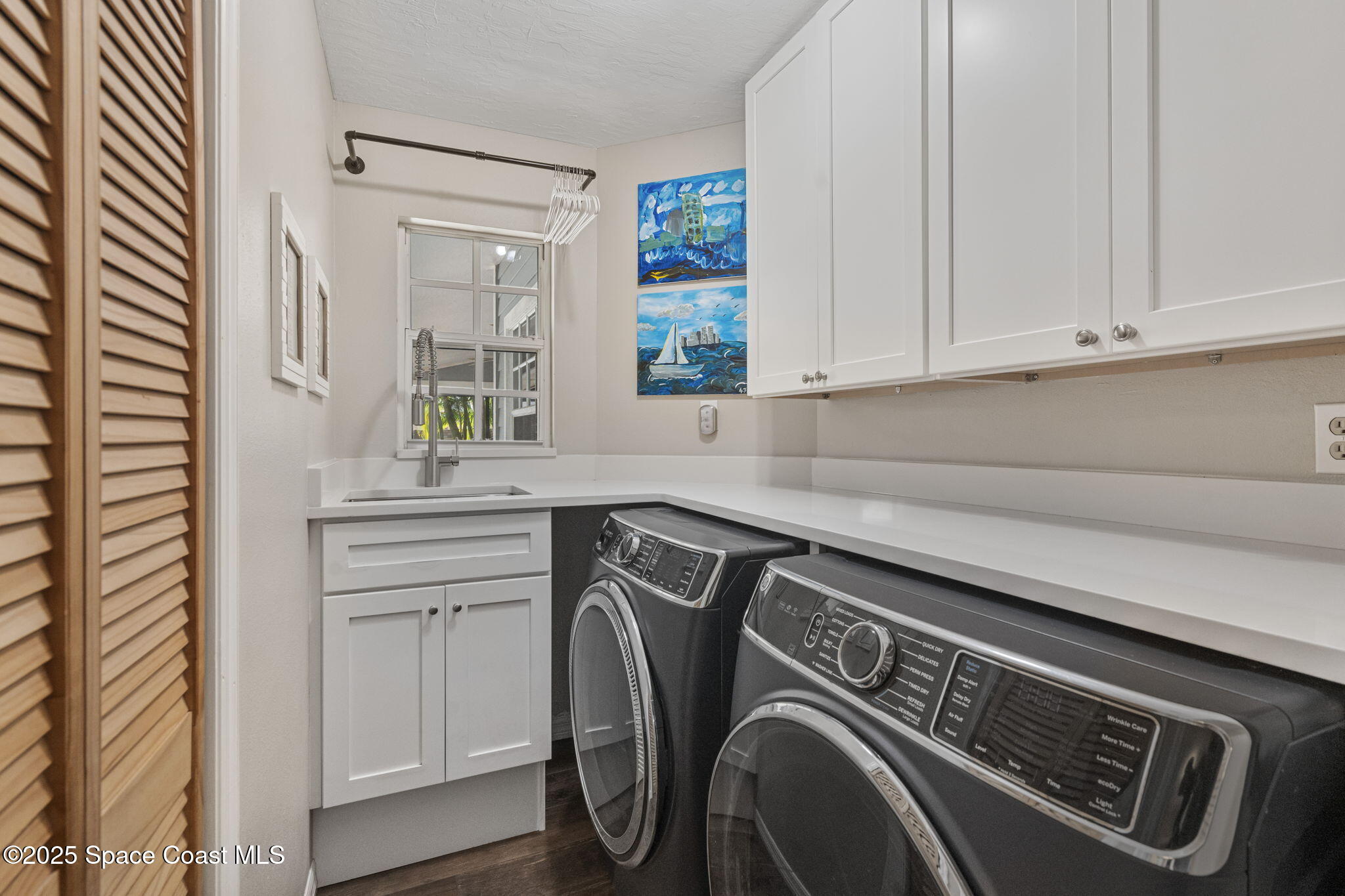 4089 Mallard Drive Melbourne, FL 32934 - Photo 27 of 53 a utility room with dryer and washer