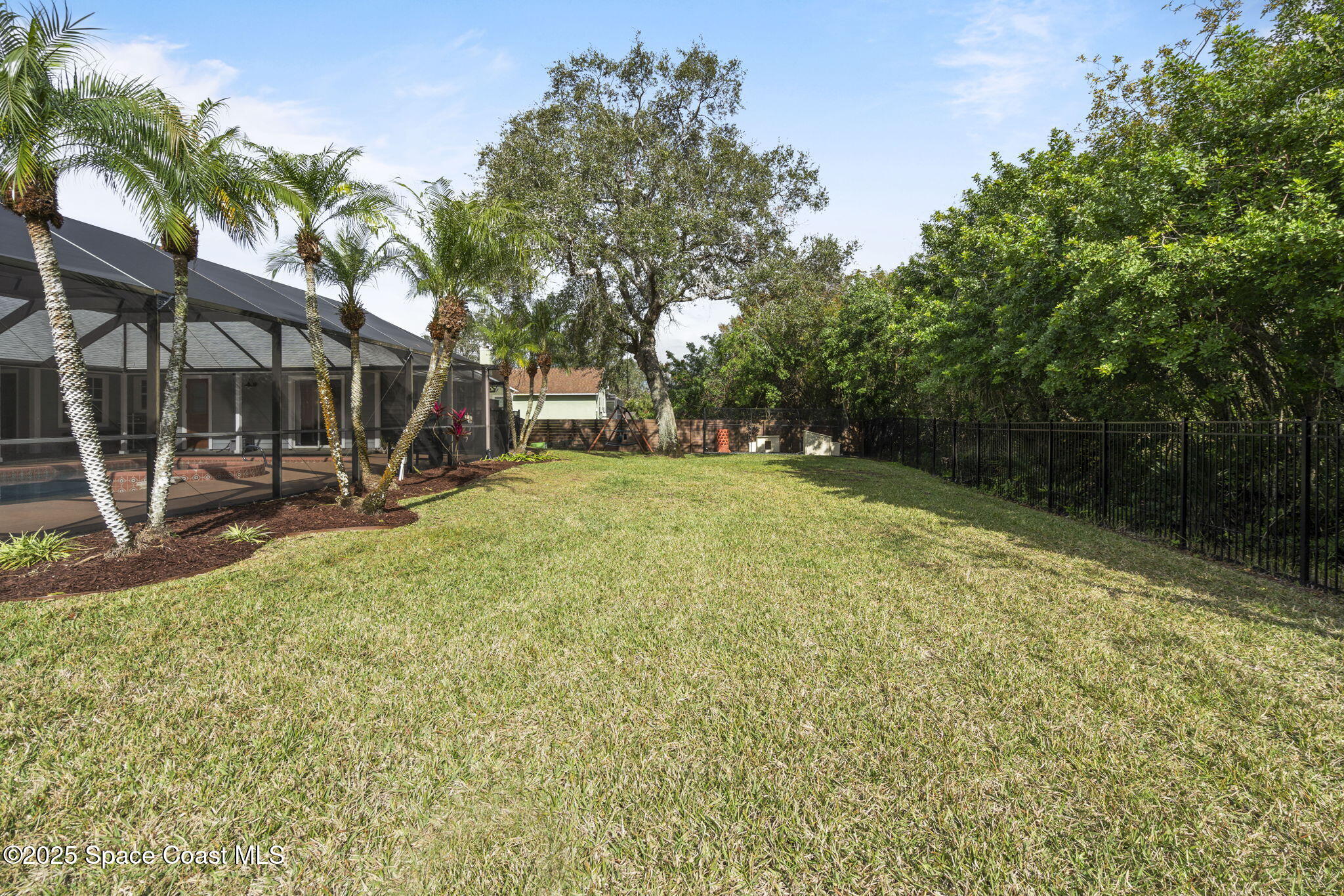 4089 Mallard Drive Melbourne, FL 32934 - Photo 40 of 53 a view of a backyard with a table and chairs