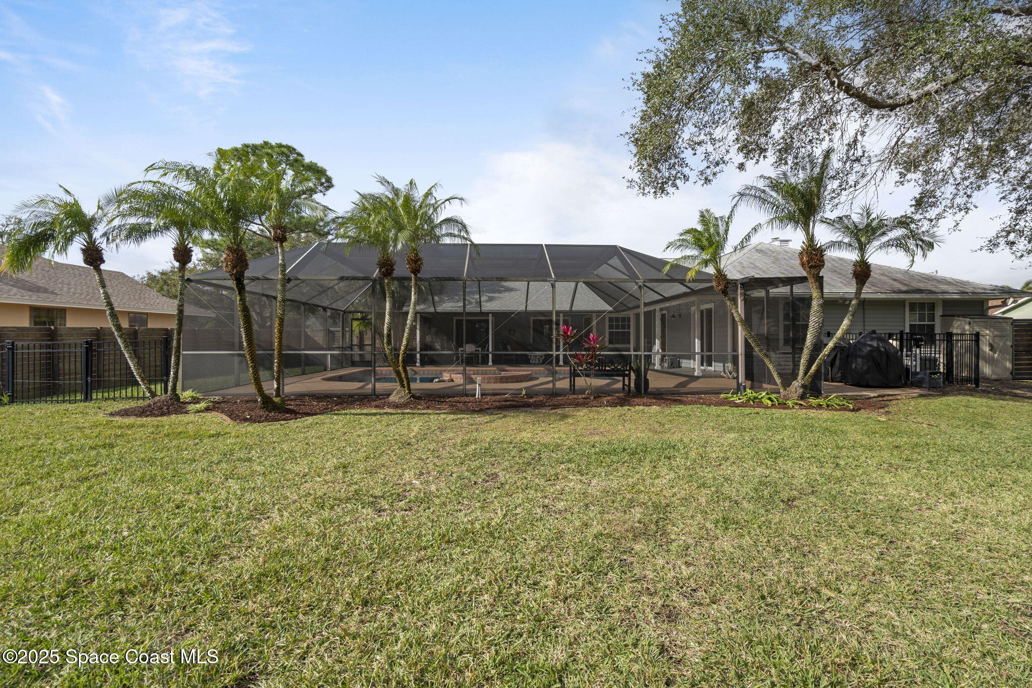 4089 Mallard Drive Melbourne, FL 32934 - Photo 41 of 53 a view of a house with backyard and a tree