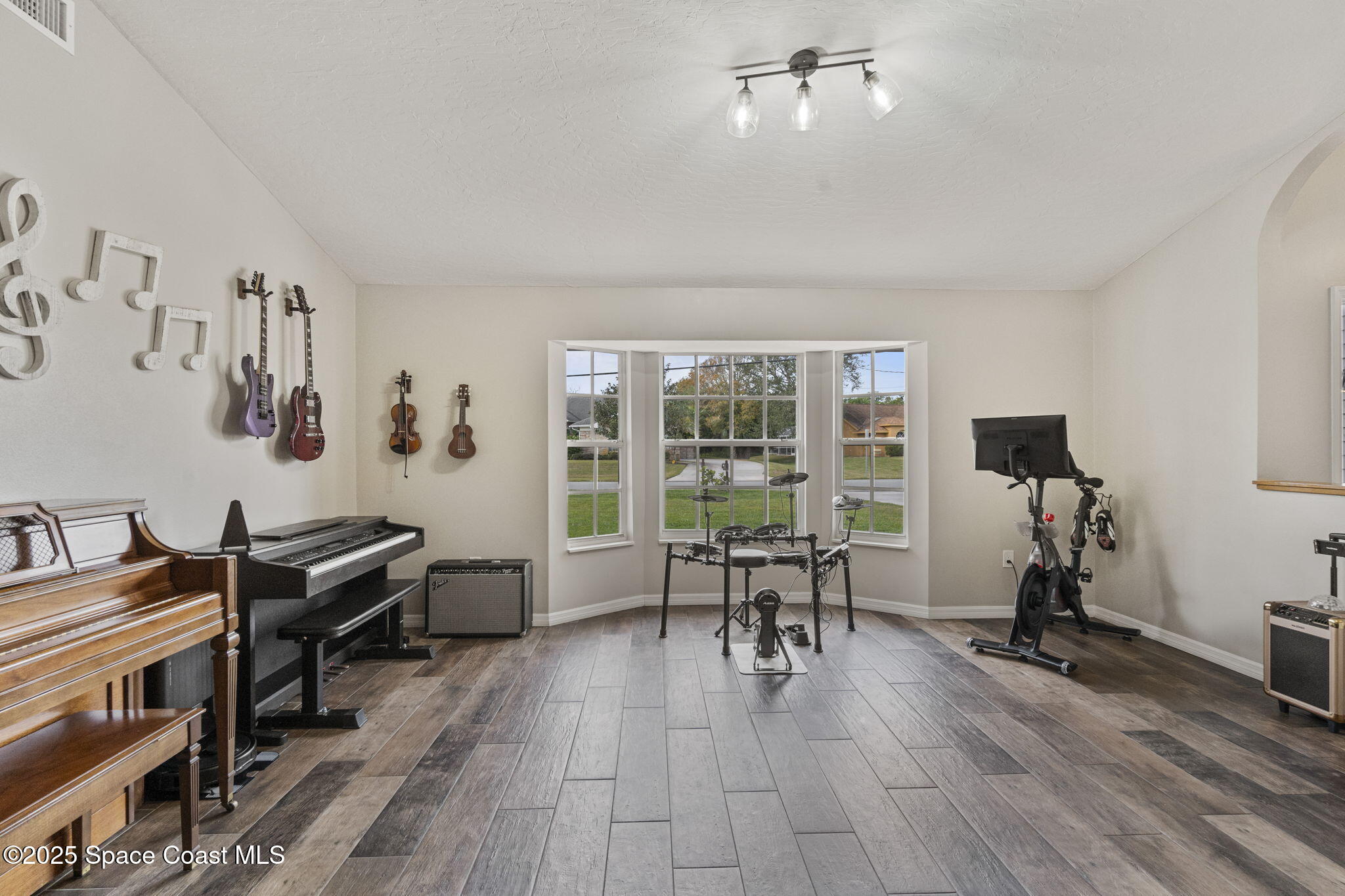 4089 Mallard Drive Melbourne, FL 32934 - Photo 7 of 53 a view of a workspace with furniture and a window