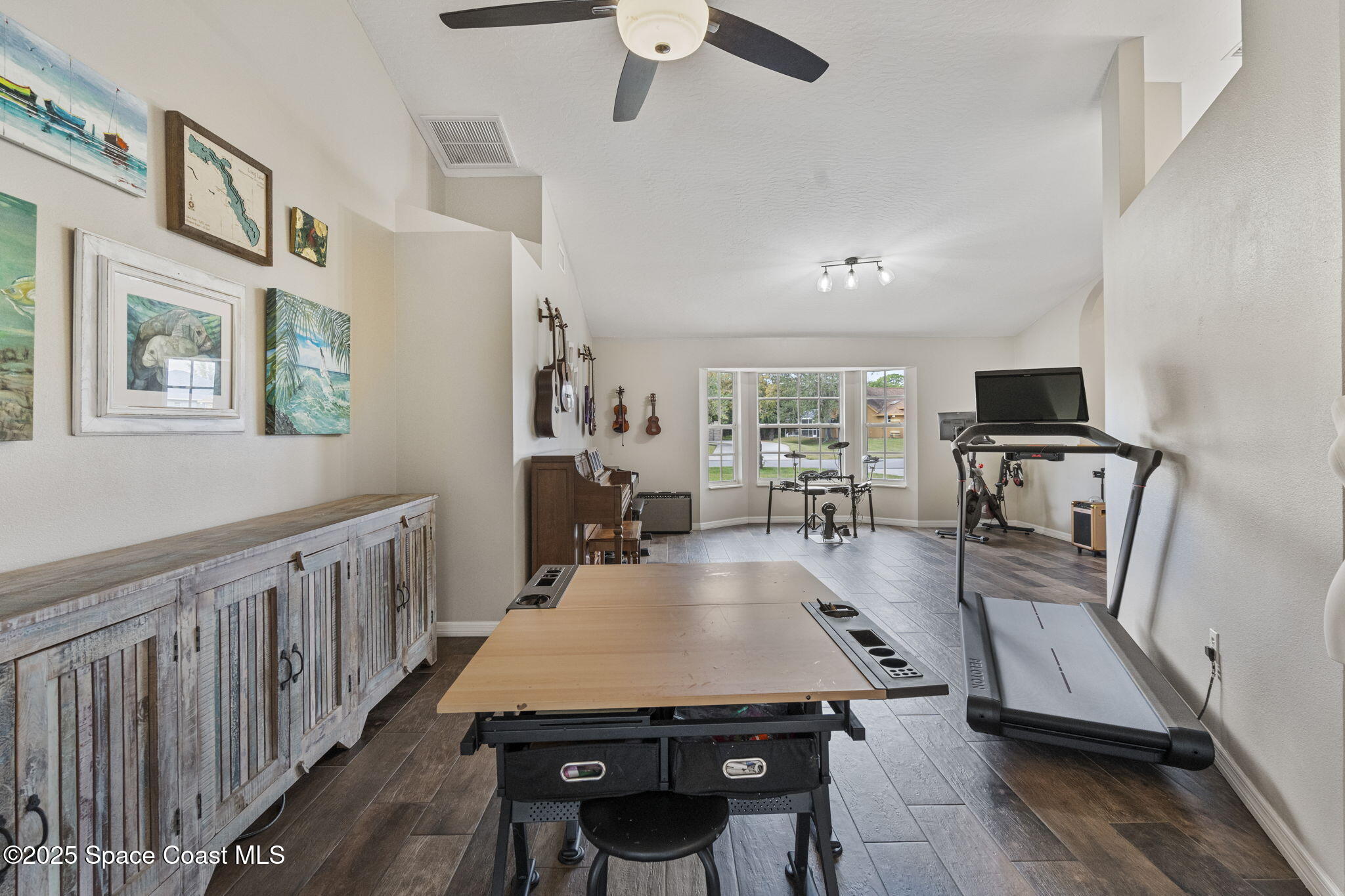 4089 Mallard Drive Melbourne, FL 32934 - Photo 9 of 53 a view of a dining room with furniture window and wooden floor