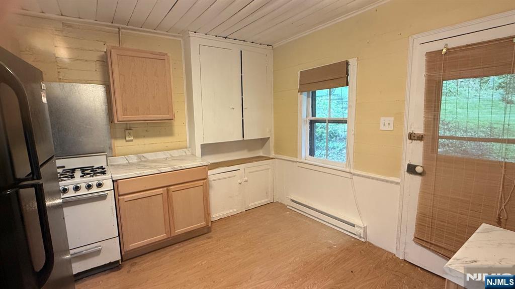 25 Coleman Hill Road Washington, NJ 07882 - Photo 10 of 18 a kitchen with granite countertop white cabinets and white appliances