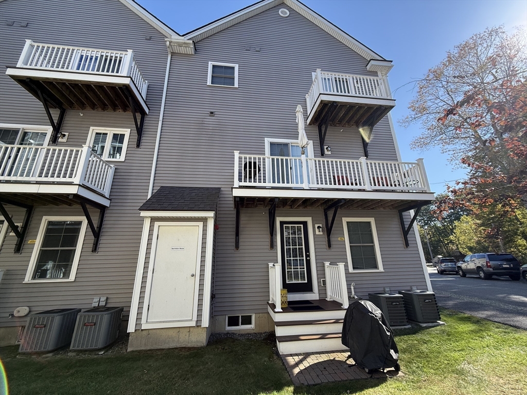 66 Compass Point, Unit 66 North Andover, MA 01845 - Photo 5 of 42 a front view of a house with garden