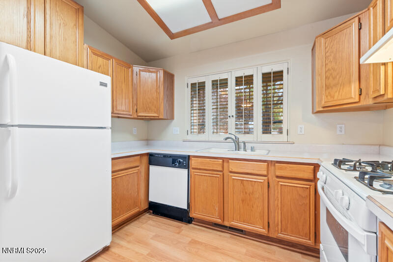 2990 Scottsdale Road Reno, NV 89512 - Photo 7 of 18 a kitchen with stainless steel appliances granite countertop a stove a sink and a refrigerator