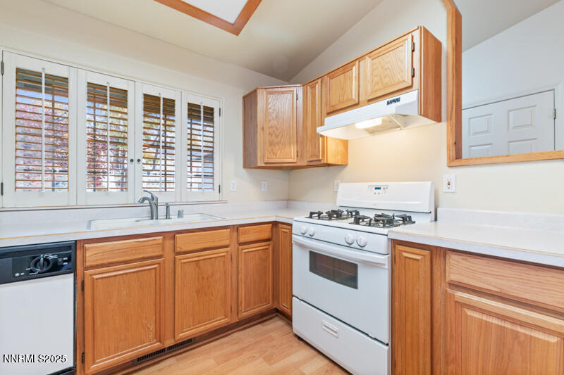2990 Scottsdale Road Reno, NV 89512 - Photo 8 of 18 a kitchen with granite countertop cabinets stainless steel appliances and a sink