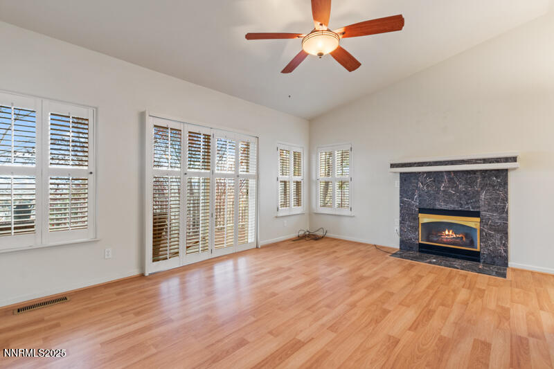 2990 Scottsdale Road Reno, NV 89512 - Photo 10 of 18 wooden floor fireplace and windows in an empty room
