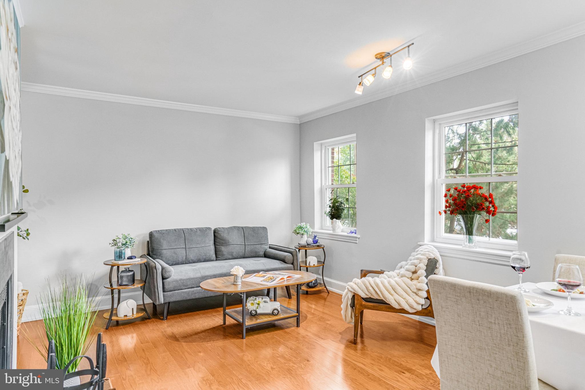 2106 North Scott Street, Unit 40 Arlington, VA 22209 - Photo 19 of 34 a living room with furniture and a large window