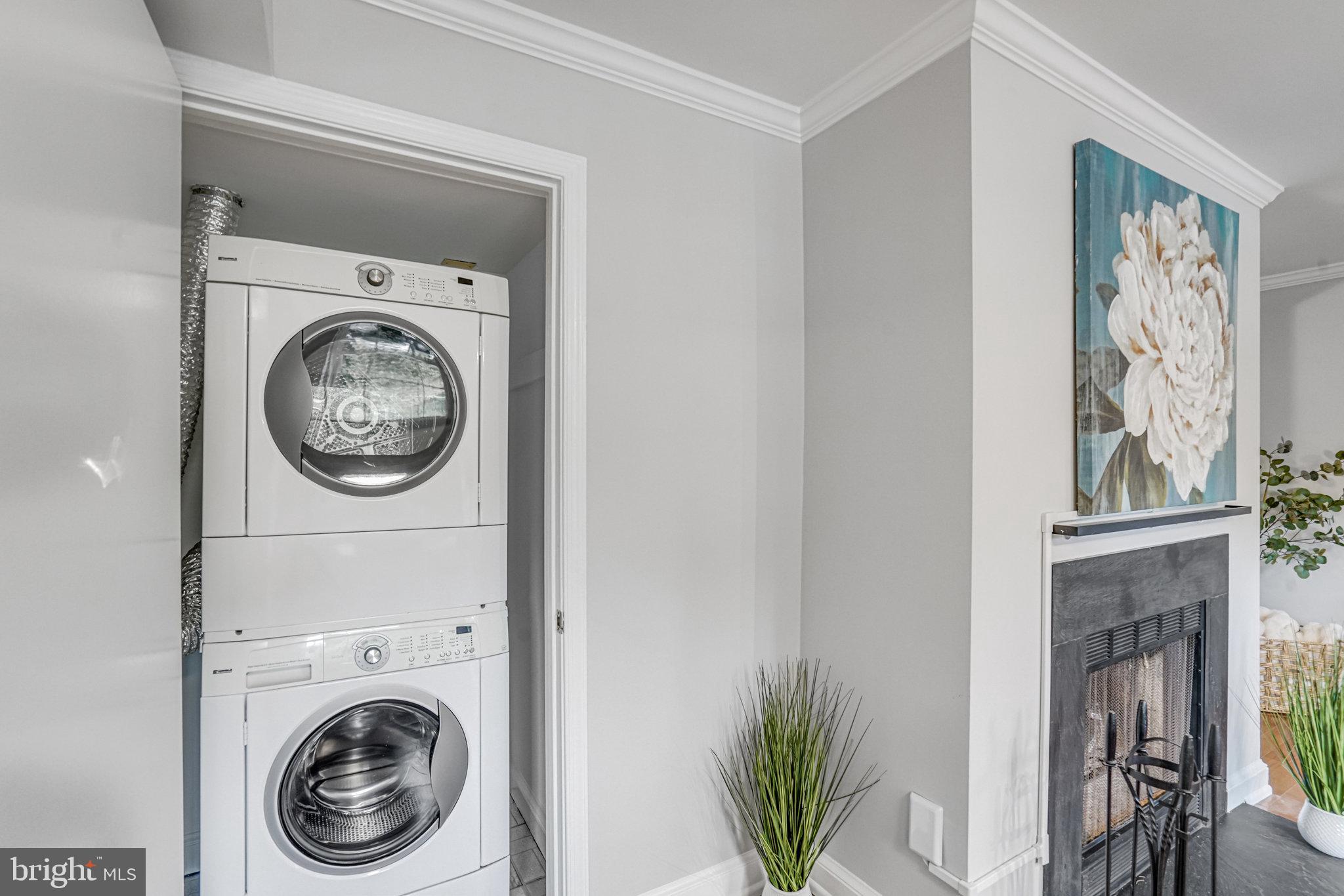 2106 North Scott Street, Unit 40 Arlington, VA 22209 - Photo 25 of 34 a view of a hallway with washer and dryer