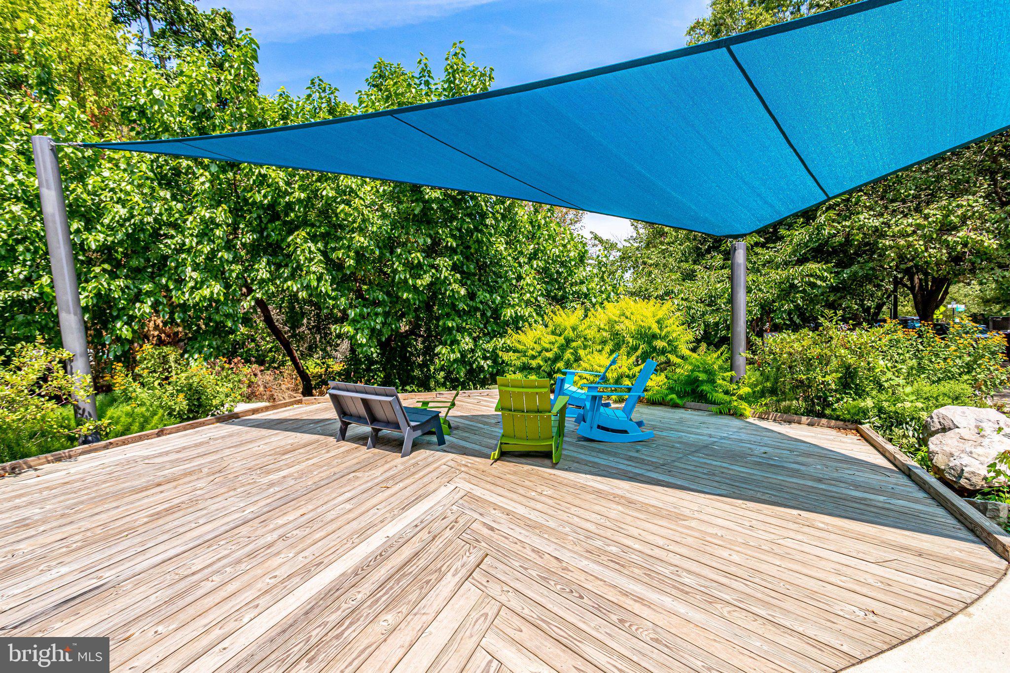 2106 North Scott Street, Unit 40 Arlington, VA 22209 - Photo 31 of 34 a view of a patio with table and chairs under an umbrella