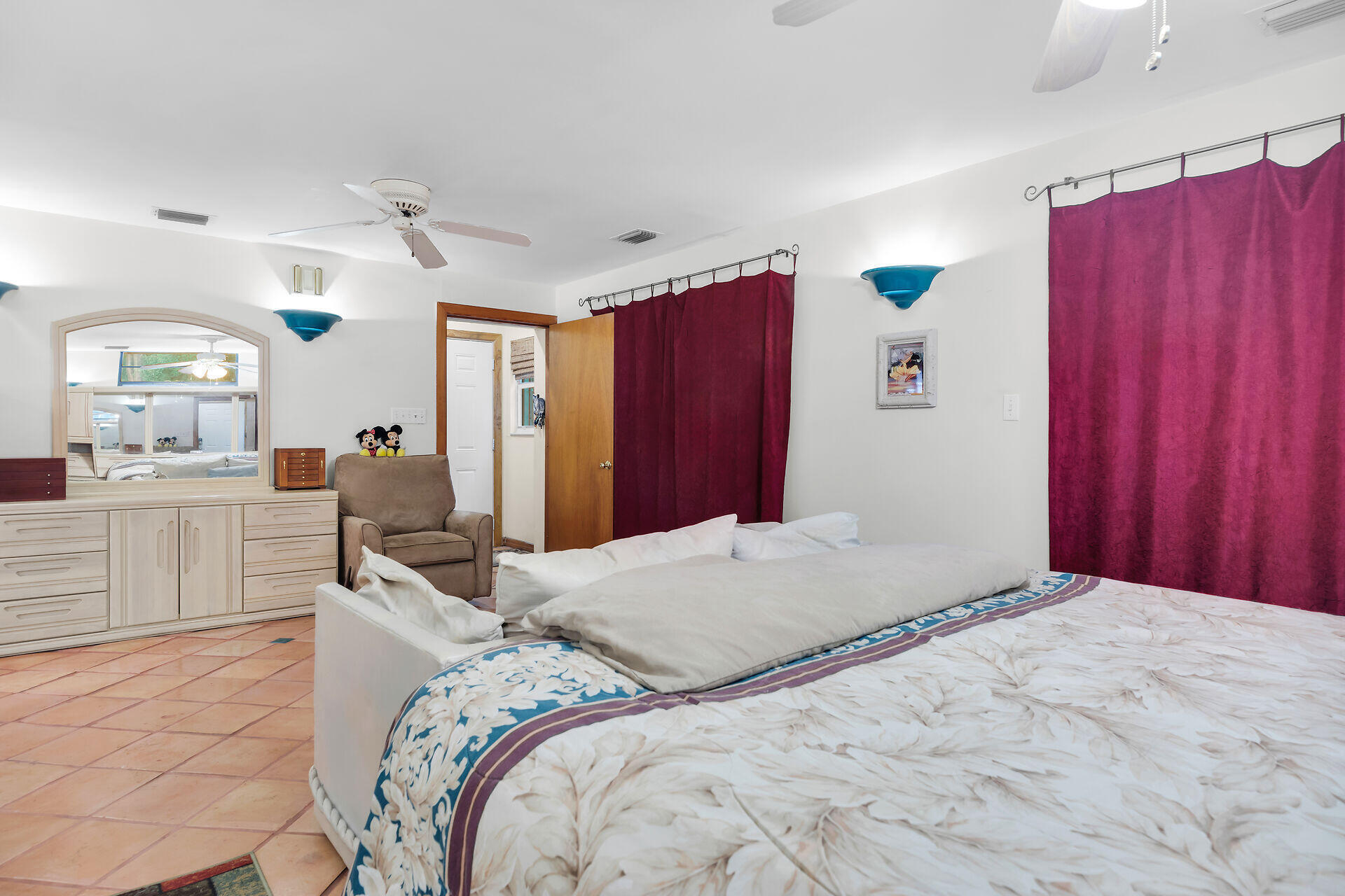 323 Bayview Avenue Key Largo, FL 33037 - Photo 11 of 46 a bedroom with a bed and a view of kitchen