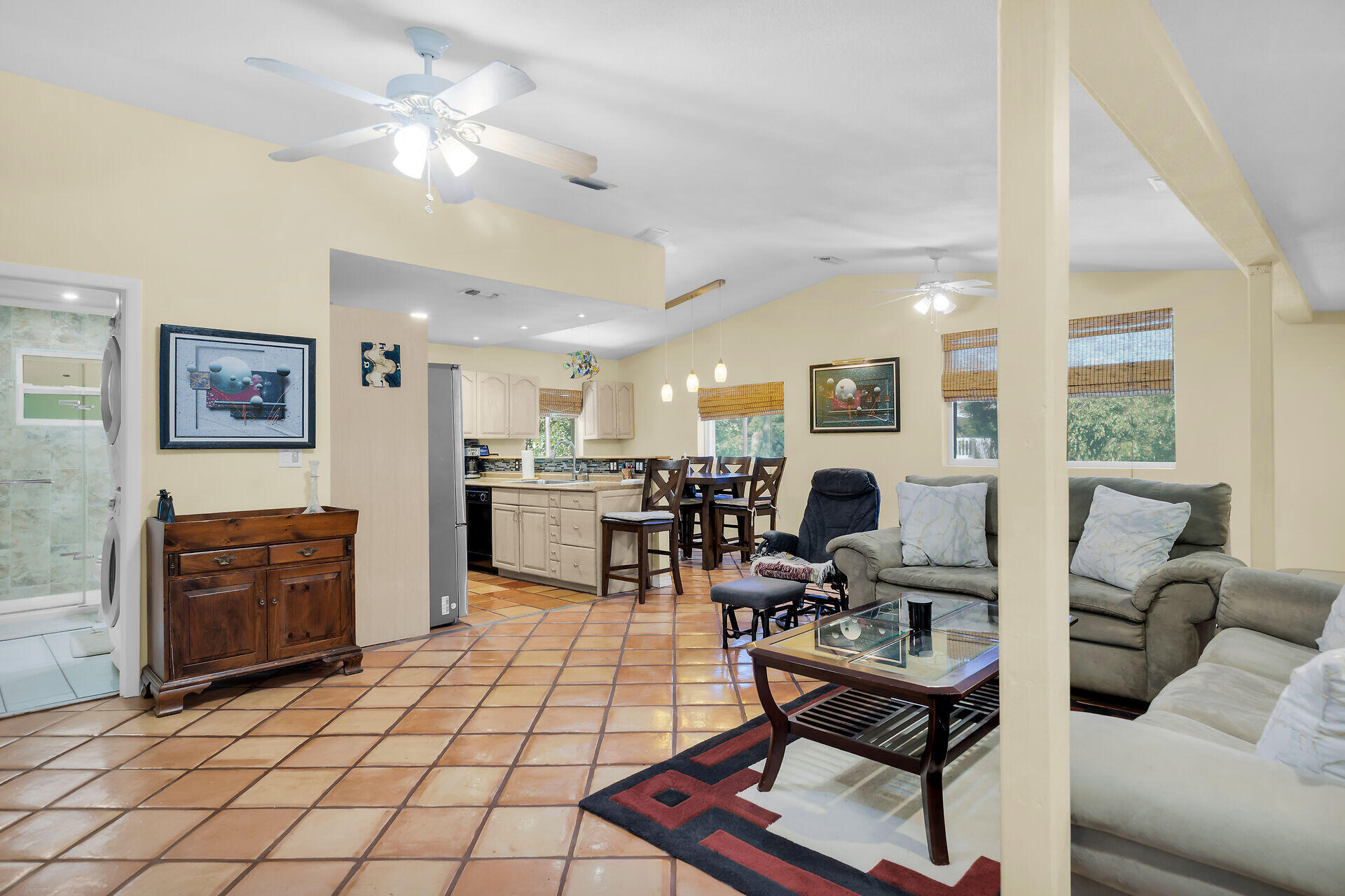 323 Bayview Avenue Key Largo, FL 33037 - Photo 17 of 46 a living room with furniture a flat screen tv and a table