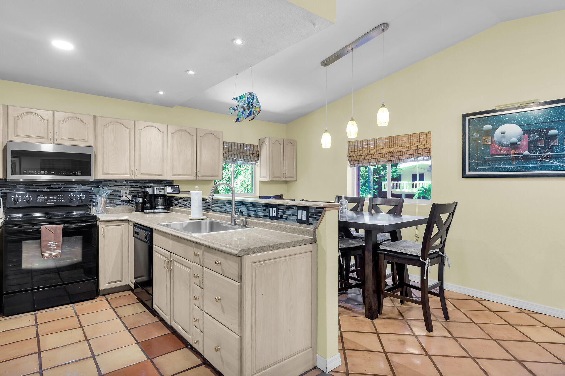 323 Bayview Avenue Key Largo, FL 33037 - Photo 26 of 46 a kitchen with a cabinets and chairs