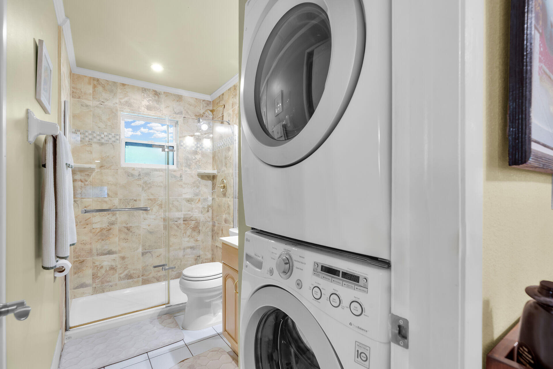 323 Bayview Avenue Key Largo, FL 33037 - Photo 31 of 46 a view of bathroom with washing machine and mirror