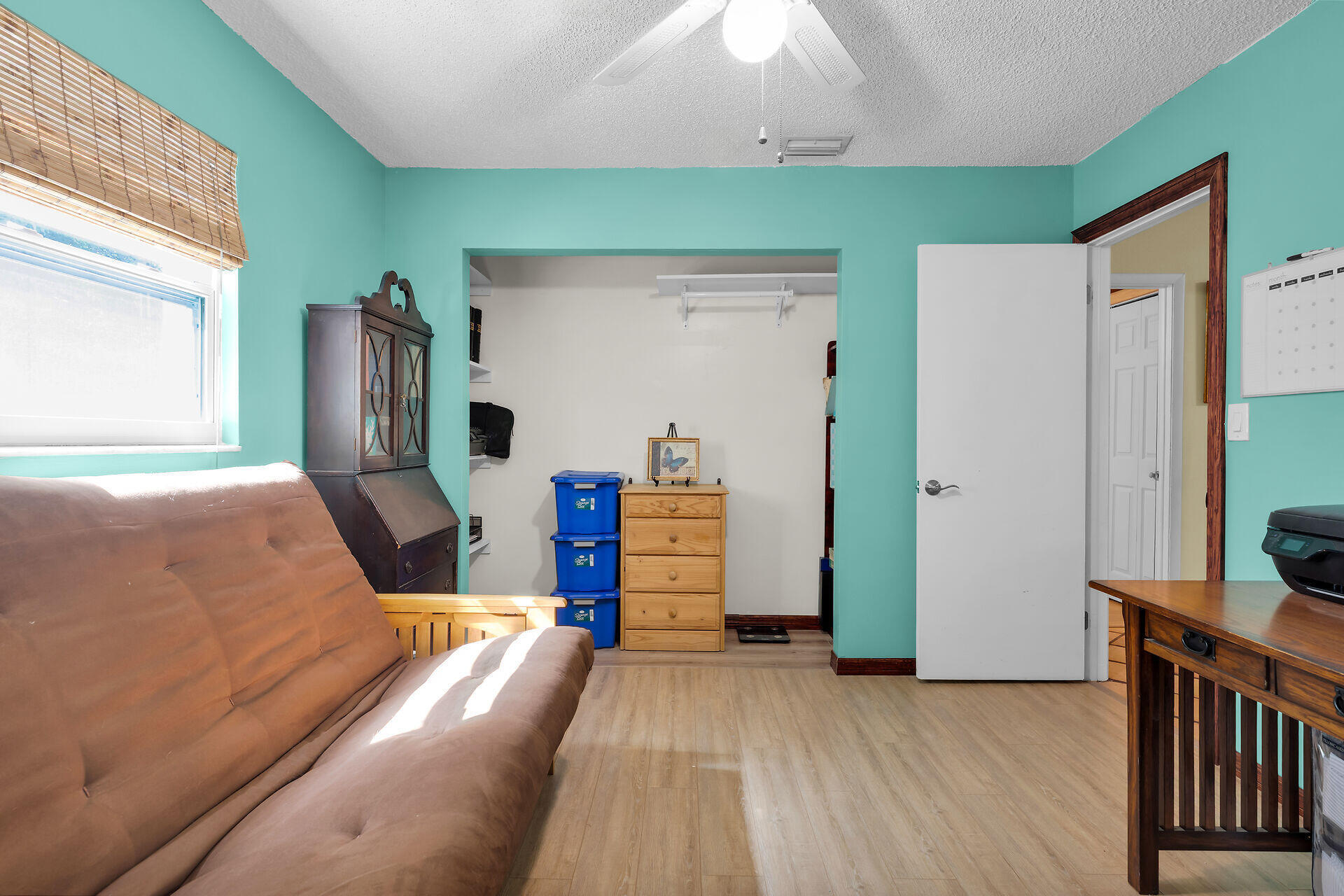 323 Bayview Avenue Key Largo, FL 33037 - Photo 34 of 46 a bedroom with furniture and a wooden floor