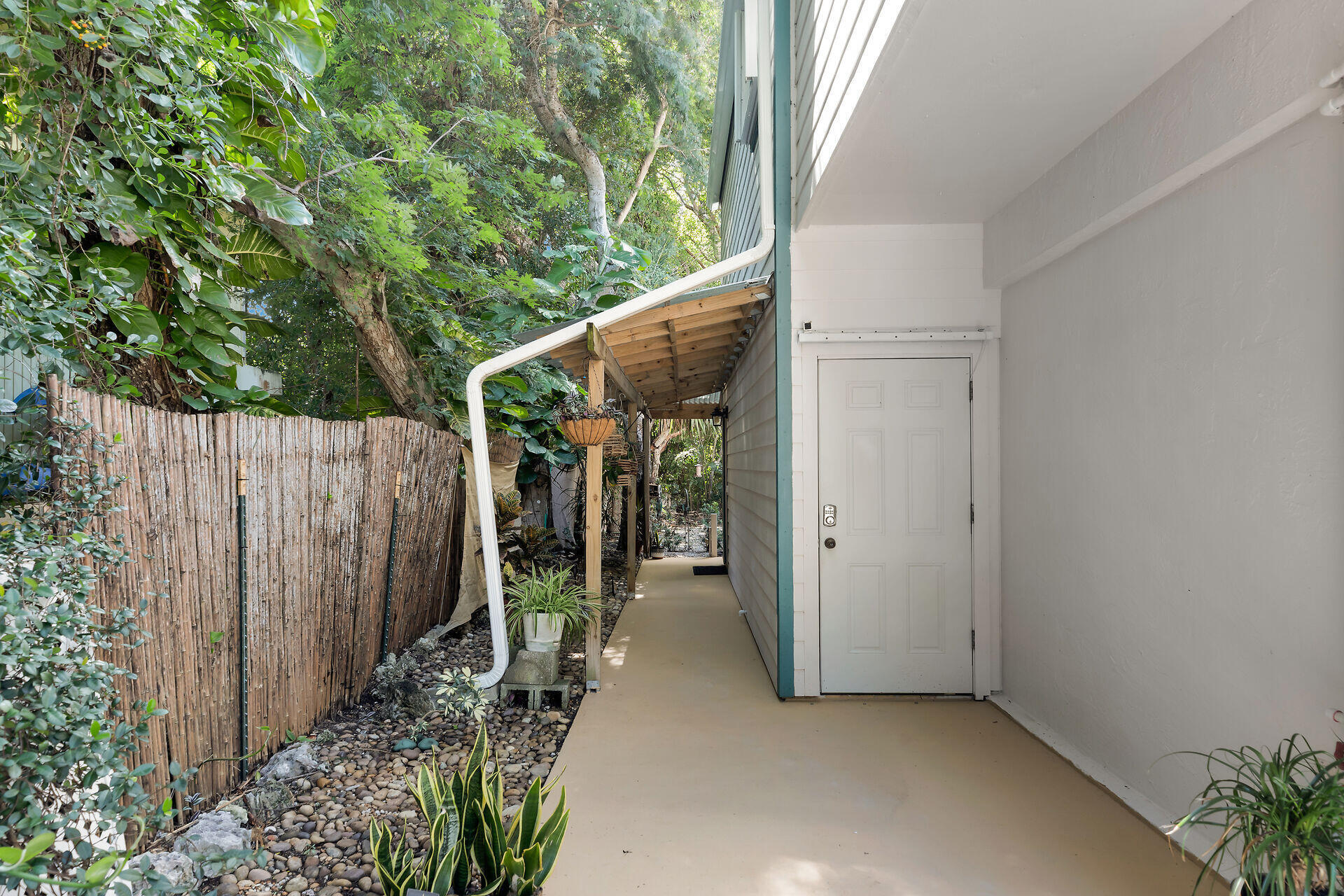323 Bayview Avenue Key Largo, FL 33037 - Photo 4 of 46 a view of a house with backyard and wooden fence