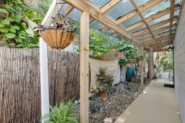 a path view of a garden with a fountain
