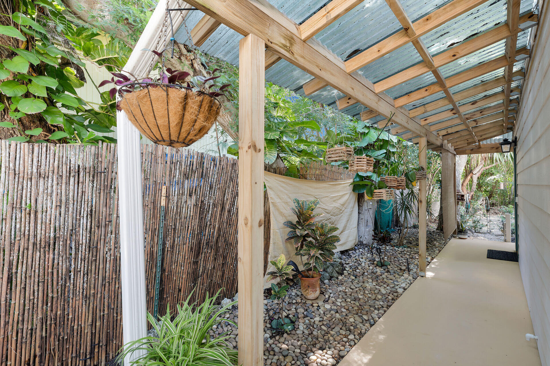 323 Bayview Avenue Key Largo, FL 33037 - Photo 5 of 46 a path view of a garden with a fountain