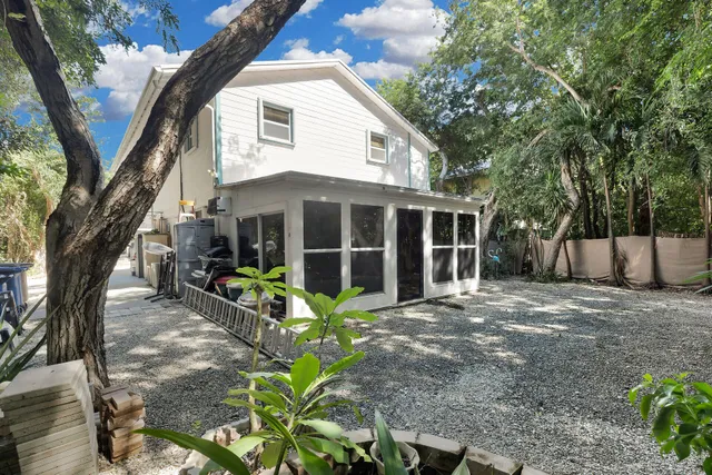 a front view of a house with sitting area